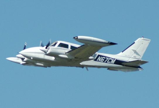 Cessna 310 in air
